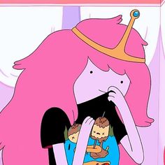 a pink haired girl with a crown on her head holding a baby in her arms