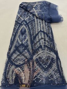 This high quality Fabric is measured in 5 Yards With Embroidered Beading and Sequin. It is soft, very delicate and beautiful. This high Quality Fabric is made with Fashion embroidered rhinestones can be used in making party wedding dresses, skirts, shawls, scarves and other other fashion apparels as you would like. Size : Length : 5 yards (180 inch). Width: 50 inch (Please allow slight deviation for the measurement data ,±1 inch) Material: 100% Polyester, Tulle Lace Fabric, Eco-Friendly embroide Elegant Embroidered Fabric With Rhinestones For Party, Evening Embroidered Lace Fabric With Rhinestones, Blue Embroidered Wedding Fabric With Rhinestones, Evening Lace Fabric With Rhinestones, Elegant Embroidered Blue Sequin Fabric, Elegant Blue Embroidered Sequin Fabric, Elegant Rhinestone Embroidered Fabric For Banquet, Elegant Embroidered Sequin Fabric For Banquet, Elegant Tulle Lace Fabric With Rhinestones