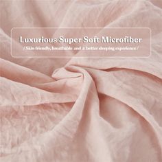 the text luxurious super soft microfiber is shown in white and light pink colors