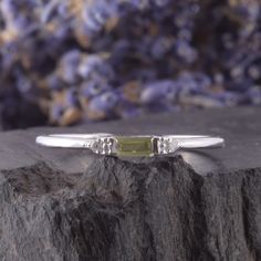 Small & Delicate peridot silver promise ring for her, Womens sterling silver promise ring,Simple silver ring for her, Baguette cut ring WE OFFER UNLIMITED PERIOD INSTALLMENTS PLAN This is a beautiful, stunning, feminine ring that works well for all occasions, styles, and ages. You will love it! Ring information: Main stone: Peridot Approximate size: 4x2mm Accent stones: Cubic zirconia Approximate size: 1.5mm (2 stones) Metal type: Silver Metal stamp: 925 Sterling Silver Installment Payments Sterling Silver Three Stone Baguette Cut Ring, Silver Dainty May Birthstone Ring, Dainty Peridot Promise Ring, Emerald Cut Birthstone Ring In White Gold For Promise, Emerald Cut White Gold Birthstone Promise Ring, White Gold Emerald-cut Birthstone Promise Ring, Green Sterling Silver Diamond Promise Ring, Dainty Green Promise Birthstone Ring, Green Dainty Promise Birthstone Ring