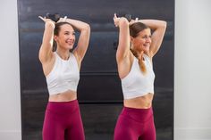 two women are doing exercises with dumbbells