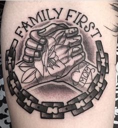 a black and white photo of a family first tattoo