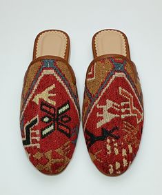 Welcome to AliDesignStore This Kilim Mules one -of-A-kind! Upper Made of a Hand-Selected Sumak Kilim Rug . Sumak Kilims Are Hand Crafted From a Mixture of Silk and Wool.and Have Stronger weave. - Handcrafted - Materials : Handwoven Sumak Kilim                        Leather Sole                        Leather Trimmed                       Leather Lining                       Stacked Leather Sole                       Rubber Under The Stacked Heel  Care:   Soft Clothing Brush İs Recommended To Clean The Slipper. İf Something Spill on it.You Can Clean İt a Cloth With shampoo. - Ships from a small business in Turkey Traditional Closed Toe Mules For Festivals, Bohemian Handmade Slip-on Mules, Traditional Brown Mules With Rubber Sole, Handmade Bohemian Closed Toe Mules, Handmade Bohemian Slip-on Mules, Traditional Natural Closed Toe Mules, Bohemian Handmade Slip-on Slippers, Handmade Bohemian Closed Toe Slippers, Traditional Brown Mules With Leather Sole