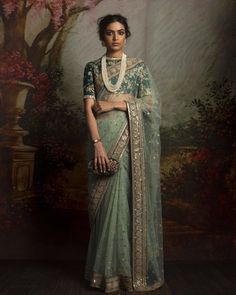 This saree featured in the mint color net fabric. The border of the saree is handcrafted in zardozi work and sequin work butties on all over saree. The blouse is in green color dupion silk with zardozi embroidery. This saree can be customized in any color of your choice. Sabyasachi Sarees, Sabyasachi Lehenga, Red Lehenga, Ghagra Choli, Designer Sarees Online, Net Saree, Saree Trends, Indian Couture, Desi Wedding