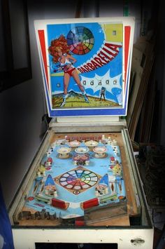 an old fashioned pinball game sitting on top of a table