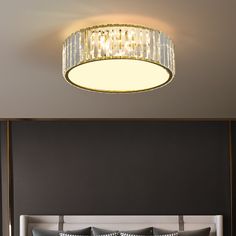 a bedroom with a bed and a chandelier hanging from the ceiling