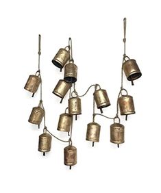 a bunch of bells hanging from the ceiling