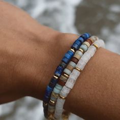 Add a retro layer of color with this natural Lapis Lazul gemstone Bracelet. A nostalgic, handcrafted pattern of genuine stone beads imported from India. MATERIAL HIGHLIGHT: Lapis Lazuli, also known as Blue Lapis is one of the most sought-after genuine stone Its deep, celestial blue remains the symbol of royalty and honor, gods and power, spirit and vision. It is a universal symbol of wisdom and truth. "Lapis Lazuli, resembling the blue of the heavens, was believed to counteract the wiles of the Bracelets With Gemstone And Heishi Beads, Handmade Agate Beaded Bracelets For Everyday, Everyday Handmade Agate Beaded Bracelets, Adjustable Lapis Lazuli Gemstone Beaded Bracelets, Bohemian Lapis Lazuli Beaded Bracelets With Natural Stones, Bohemian Beaded Bracelets With Lapis Lazuli Stones, Bohemian Beaded Bracelets With Lapis Lazuli, Adjustable Lapis Lazuli Beaded Bracelets For Everyday, Everyday Blue Beaded Bracelet With Natural Stones