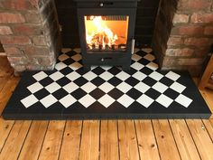 a black and white checkered floor with a fireplace