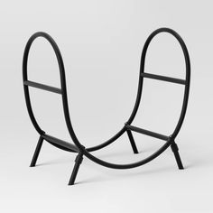 a black metal object with two curved legs