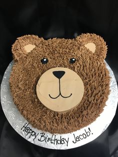 a birthday cake that is shaped like a bear