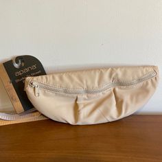 Apana Studio To Street Belt Bag Crossbody Fanny Pack Beige Casual Beige Belt Bag For On-the-go, Beige Pouch Belt Bag With Cell Phone Pocket, Beige Pouch Belt Bag, Beige Pouch Belt Bag With Zipper Closure, Versatile Beige Belt Bag With Zipper Pocket, Beige Belt Bag With Zipper Pocket For Travel, Cream Belt Bag For Travel, Casual Beige Crossbody Belt Bag, Beige Pouch Belt Bag For Travel