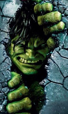 the incredible hulk movie poster with his hands on his head and green eyes, looking like he