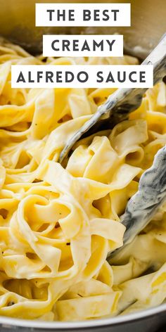 the best creamy alfredo sauce in a pan with a ladle full of pasta