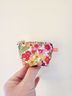 "100% Cotton. Lightweight. From the world famous Liberty Fabrics with a silk-like touch, unique print quality and striking color vibrancy. Exclusive print. Printed in Japan This mini pouch is great size for a couple of small items. Size is 3W / 2\"H / 1\"D Flat bottom shape. Fabric is Liberty of London Tana Lawn. The pouch opens with golden color zipper.(High quality YKK zipper) It comes with a velvet ribbon on one side. Lined inside with pretty baby-pink color cotton. Please, Hand wash. Or cool Multicolor Bag With Zipper Closure For Gifts, Multicolor Pencil Case With Zipper Closure As Gift, Cute Multicolor Pouch For Gift, Multicolor Zipper Pouch As A Gift, Multicolor Pencil Case With Zipper For Gift, Cute Multicolor Cosmetic Bag With Zipper Pouch, Cute Multicolor Cosmetic Bag As Gift, Multicolor Pouch Coin Purse As Gift, White Coin Purse As A Gift