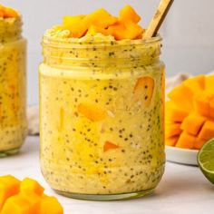 two mason jars filled with mango chia pudding