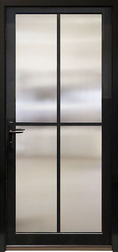 an open door with frosted glass on the side and black frame, in front of a white wall