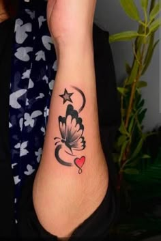 a woman's arm with a butterfly tattoo on the left side of her body