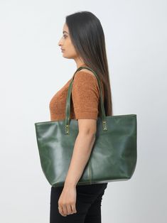 Trustpilot This Kim Tote is a yet stylish women's tote handbag that is a great choice for a trendy look. The simple classic design in green color makes it superior. The zipper gives easy access to the main compartment which has one small zipper pocket inside the compartment for keeping your accessories and other small items securely and separately. This women's leather tote bag is made of the finest quality buffalo leather accentuated with intricate detailing on the stitches. We offer excellent Leather Tote Bag Women, Student Bag, Monogram Tote, Leather Bag Women, Buffalo Leather, Tote Handbag, Women Leather, Bag For Women, Womens Tote