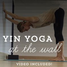 a woman is doing yoga on a mat with the words yin yoga at the wall