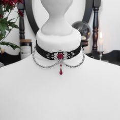 "'Ornate Rose' Choker: Black velvet ribbon choker with a filigree design, ribbon rose, chains and a drop charm. The chains are stainless steel. Fastens with a clasp and chain. About 12\" in length (excluding the extension chain) and 15\" including the extension chain. The extension chain can be made longer if you would prefer. Please upgrade to tracked shipping at the checkout if you would like to be able to track your order once it has been shipped. For more information on shipping take a look at my 'About' section on my shop page or my FAQ. Thank you and if you have any other questions please don't hesitate to contact me. ☆" Elegant Metal Choker For Valentine's Day, Gothic Style Chain Choker As Gift, Gothic Chain Choker As Gift, Gothic Chain Jewelry For Valentine's Day, Valentine's Day Silver Elegant Choker, Gothic Valentine's Day Chain Jewelry, Victorian Metal Choker For Gift, Victorian Metal Choker As Gift, Victorian Metal Choker Gift