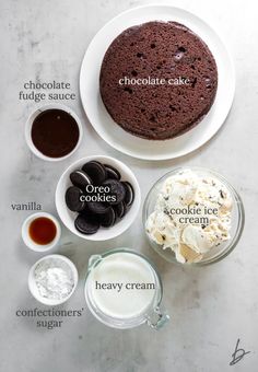 ingredients for chocolate cake on a white table with words describing the ingredients and how to make it