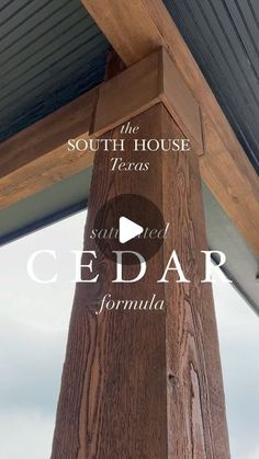 the south house cedar column with text overlaying it