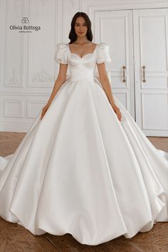 Princess fairy garden timeless wedding dress with long train and short sleeves Elegant Wedding Dress With Puff Sleeves, Silk Puff Sleeve Wedding Dress, Princess Wedding Dress Short Sleeves, Wedding Dress Ball Gown With Sleeves, Bubble Sleeve Wedding Dress, Simple Ball Gown Wedding Dress, Princess Wedding Dresses With Sleeves, Ballgown Wedding Dress With Sleeves, Wedding Dresses With Bows