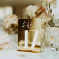 a table number sitting on top of a white table