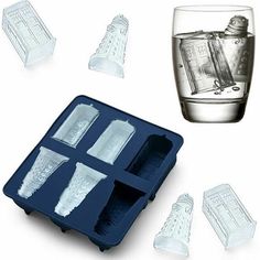 an ice tray with four pieces of glass in it, and one piece is empty