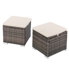 two brown wicker ottomans with white cushions on each side and an ottoman in the middle