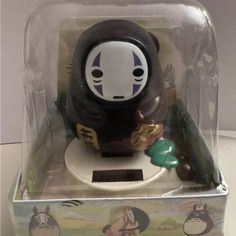 a black and white toy in a clear box