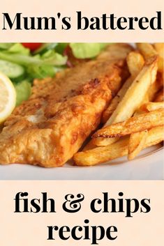 fish and chips on a plate with lettuce, lemon wedges and a salad