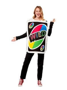 a woman in a black and white shirt is holding a sign that says wild on it