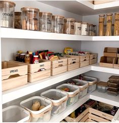 an organized pantry filled with lots of food and storage bins on the shelves,