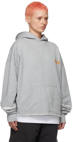 Cotton fleece hoodie. Raw edges throughout. · Logo embroidered at chest · Kangaroo pocket · Rib knit cuffs We recommend sizing up for an oversized fit. Available exclusively at SSENSE. Supplier color: Heather grey Oversized Hoodie With Embroidered Logo For Winter, Oversized Winter Hoodie With Embroidered Logo, Relaxed Fit Hoodie With Embroidered Logo For Streetwear, Winter Hoodie With Embroidered Logo And Relaxed Fit, Oversized Hooded Sweatshirt With Embroidered Logo, Gray Hoodie With Embroidered Logo For Fall, Fall Streetwear Hoodie With Embroidered Logo, Fall Crew Hoodie For Streetwear, Crew Neck Hoodie For Fall Streetwear