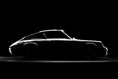 a black and white photo of a car in the dark