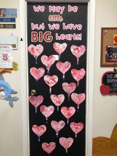 a bulletin board with hearts on it that says, we may be who but we have big hearts