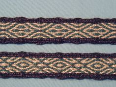 two crocheted ribbons are shown on a blue background, one is green and the other is brown