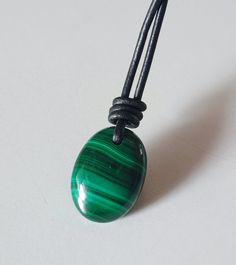 "Taurus Men's Stone Necklace, handmade Malachite necklace, with an adjustable black leather cord necklace. Malachite necklace men, malachite crystal necklace. Necklace Pendant. necklace length 15\"-30\" adjustable    Stone size -  17 × 23mm(approx) Stone weight:-33.60 carat  Malachite stone:- Malachite is suitable for people born between April and May. This means Malachite is a Taurus birthstone and it will bring this sign a lot of success, increased energy and physical healing Malachite has a strong energy  and with a power to protect you from negative entities.This green stone has an impressive energy that is high effective. It has a strong vibration within the heart chakra . Malachite stone is also known as the Kidney stone  Please be aware that it is handmade, so it can be inaccuracy o Adjustable Oval Pendant Necklace For Gift, Adjustable Oval Necklace As Gift, Adjustable Oval Necklace Perfect For Gifts, Adjustable Gemstone Necklace With Oval Pendant, Gift Necklace With Adjustable Waxed Cord, Adjustable Oval Pendant Gemstone Necklace, Waxed Cord Jewelry With Round Pendant As Gift, Waxed Cord Jewelry With Round Pendant For Gift, Waxed Cord Pendant Necklace Gift