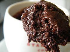 chocolate ice cream in a white bowl on a table