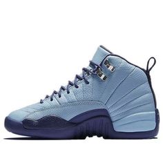 Jordan Brand is set to release a new colorway of the Air Jordan 12 Retro GG exclusively in girls’ sizes. This latest version of the shoe is inspired by North Carolina’s NBA franchise, the Charlotte Hornets. The shoe features a Blue Cap upper with Dark Purple Dust accents on the outsole, laces, and inner lining. Metallic silver details are also present on the eyelets and tongue. The Air Jordan 12 Retro GG ‘Hornets’ is a perfect choice for any girl who wants to show her support for her favorite te Jordan Retro 12, Air Jordan 12, Air Jordan 12 Retro, Jordan 12 Retro, Jordan 12, Jordans 12, Charlotte Hornets, Hornet, Nike Air Jordan