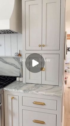 a kitchen with white cabinets and marble counter tops in the middle of it, is shown