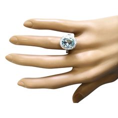 Stamped: 14K White GoldTotal Ring Weight: 5.9 GramsRing Length: N/ARing Width: N/AGemstone Weight: Total Natural Aquamarine Weight is 2.70 Carat (Measures: 10.95x9.02 mm)Color: BlueDiamond Weight: Total Natural Diamond Weight is 1.25 CaratColor: F-G, Clarity: VS2-SI1Face Measures: 15.63x15.22 mmSku: [703826W] Collectible Sapphire Ring With Center Stone, Collectible Round Sapphire Ring With Center Stone, Formal Topaz Ring With Round Stone, Gia Certified Round Cut Topaz Ring For Formal Occasions, Formal Halo Ring With Gemstone Round Stone, Formal Halo Ring With Round Gemstone, Gia Certified Blue Topaz Anniversary Ring, Formal Gia Certified Round Stone Ring, Formal Fine Jewelry Topaz Ring With Round Stone