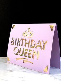 a pink birthday card with gold foil on the front that says,'birthday queen '