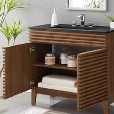 a bathroom with a sink and wooden cabinet