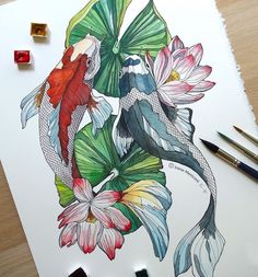 a drawing of two fish and flowers on paper