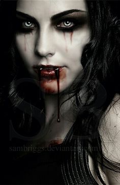 a woman with blood dripping down her face