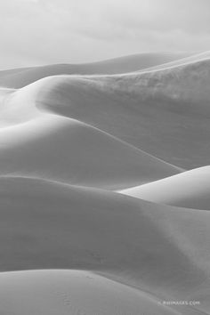 black and white photograph of sand dunes in the desert