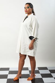 ivory shirt dress with roll up sleeves detailed with double stitch embroidery and upcycled fabric facing.
Components: 1
Pattern: Placement Stitch Embroidery
Neckline: Collared Neck
Sleeve Type: Full Sleeves
Color: Ivory
Other Details: 
Contrast cuffs
Occasion: Party - Aza Fashions White Workwear Dresses With Cuffed Sleeves, White Cotton Dresses With Placket, White Long Sleeve Dress With Cuffed Sleeves, White Dress With Cuffed Sleeves For Work, White Cotton Shirt Dress With Placket, White Shift Shirt Dress For Daywear, White Tunic Shirt Dress For Spring, White Dress With Cuffed Sleeves, Chic White Dresses With Cuffed Sleeves